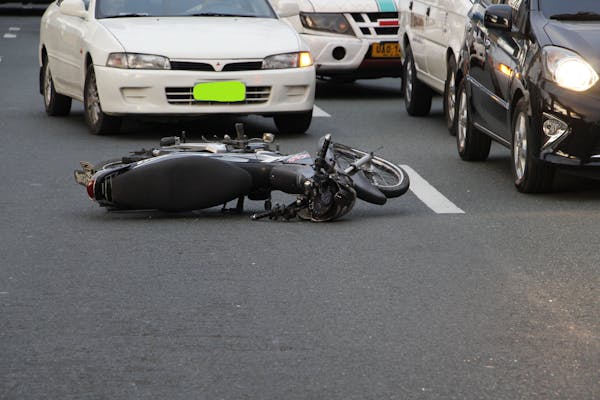 A motorcycle lying on the road.