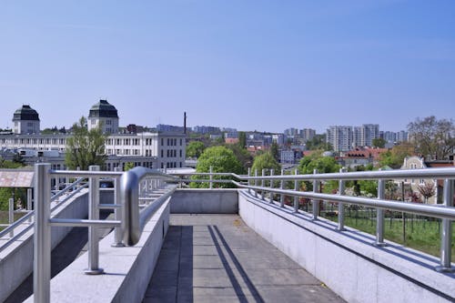 Gray Concrete Walkway with Metal Handrails 