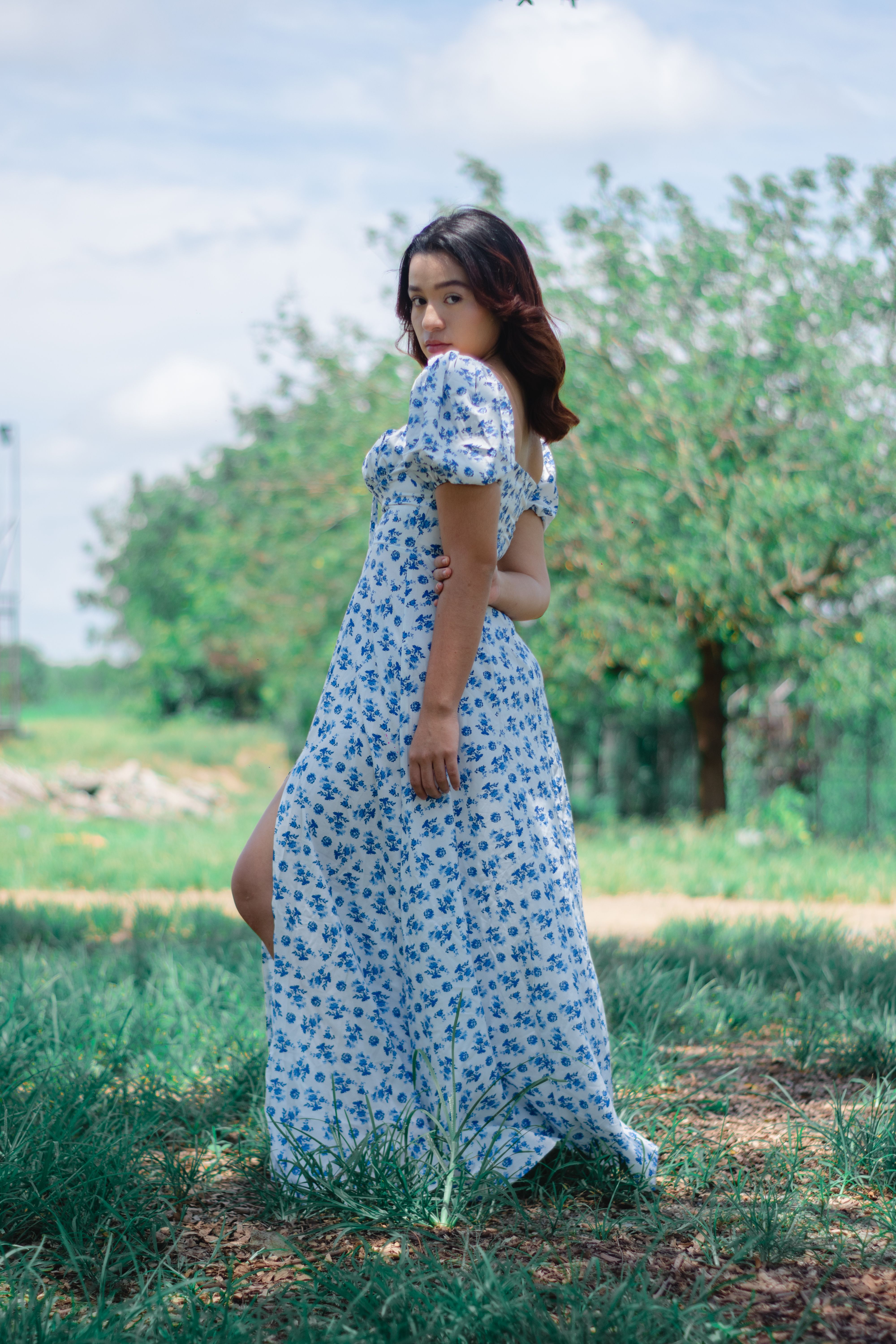 A Woman Posing in a Dress · Free Stock Photo