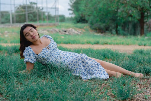 Woman Lying on Green Grass