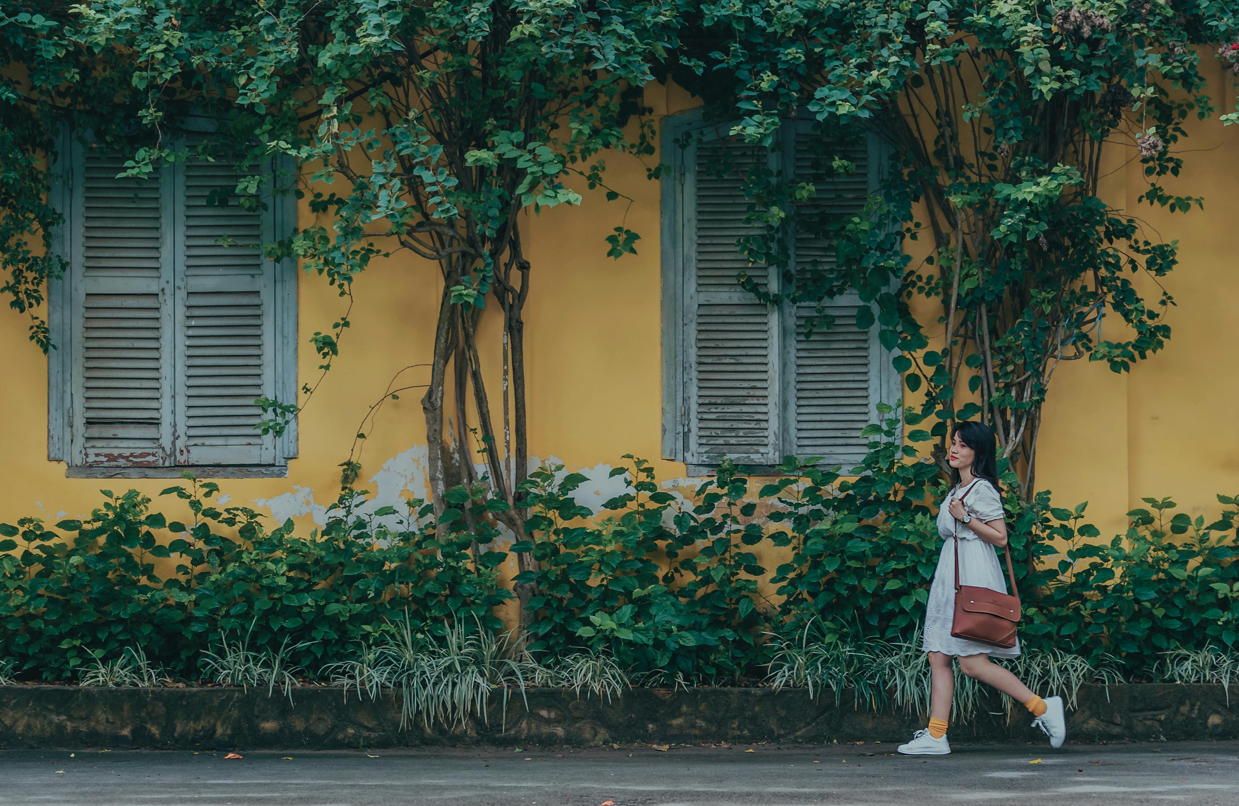 solo traveler exploring a vibrant street market in Singapore - safest countries to travel alone as a woman