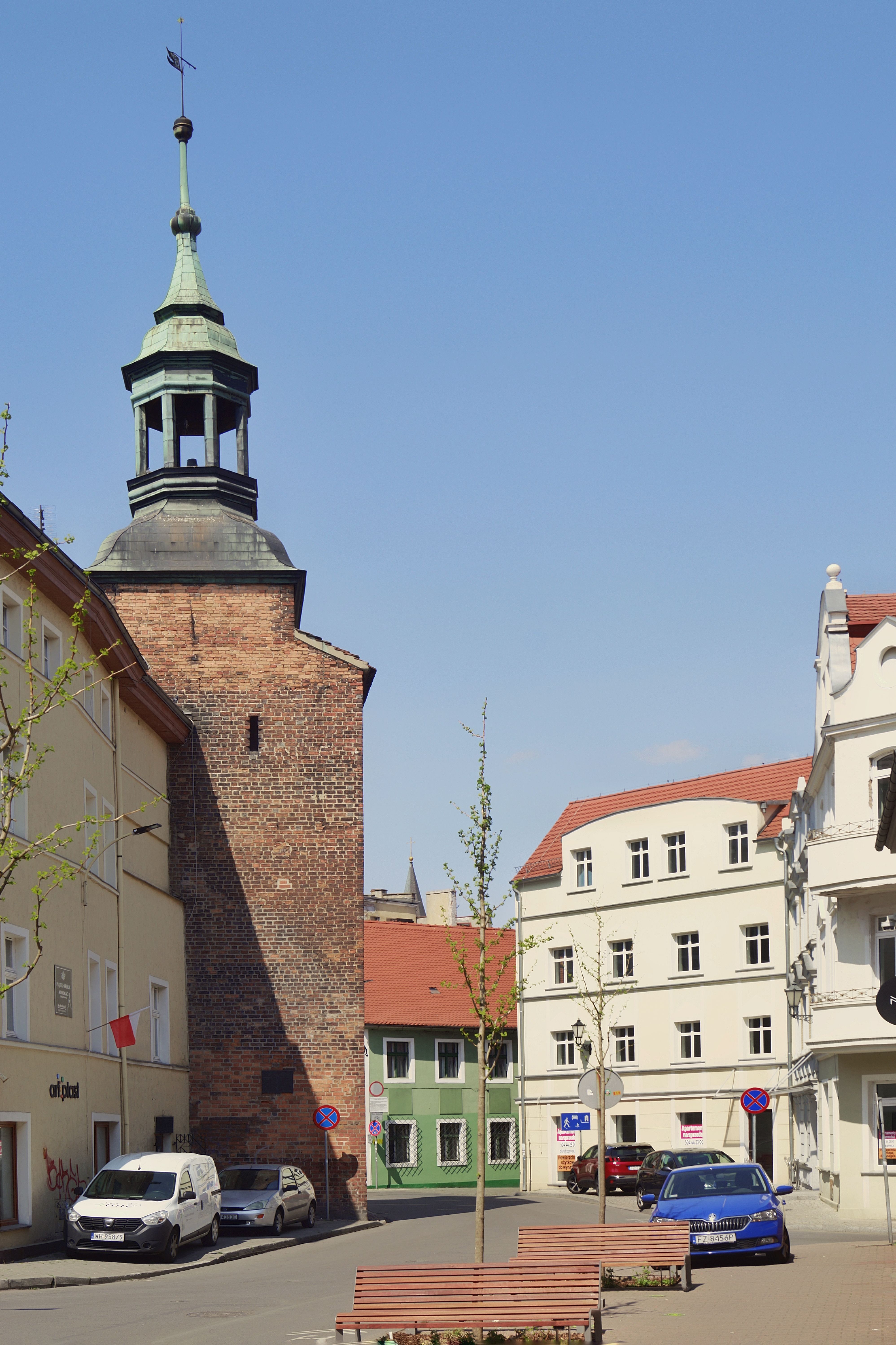 Explore the charming historic architecture of Zielona Góra's old city under a clear blue sky.