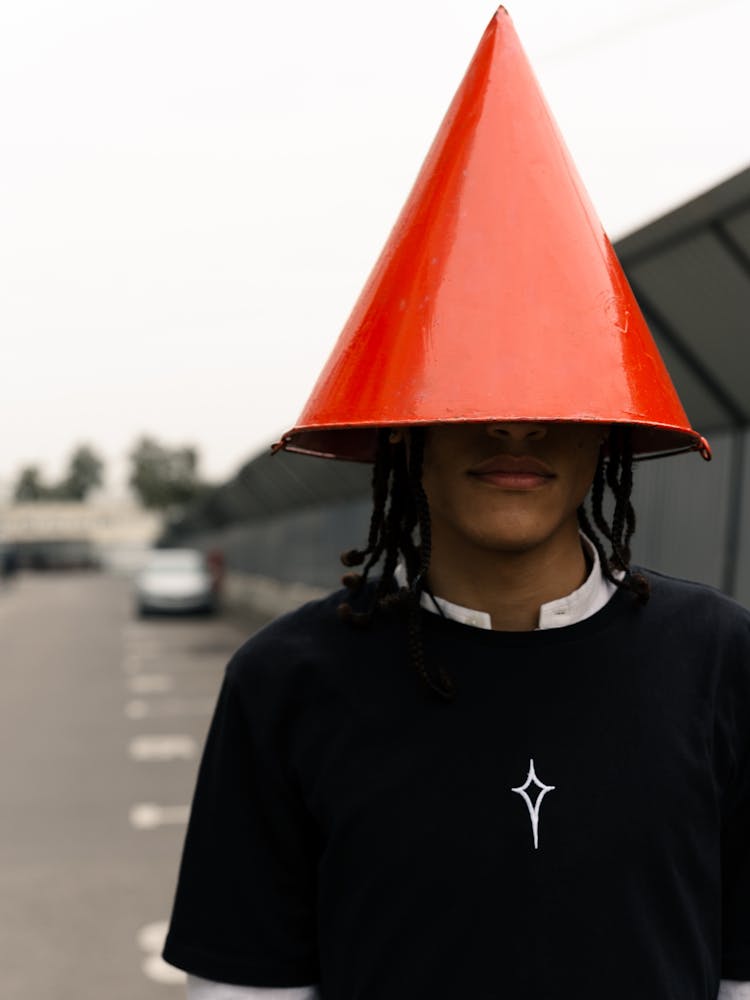 Man Wearing A Cone On His Head 