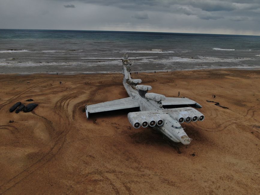 Aerial view of an abandoned Ekranoplan on the sandy shore of the Caspian Sea in Dagestan.