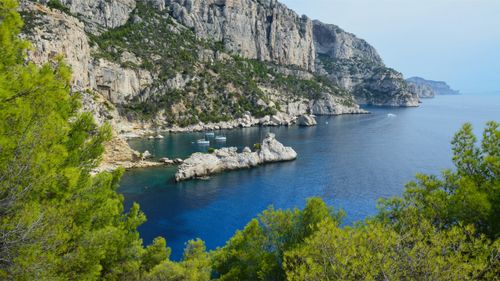 Free Breathtaking view of the Calanques' rocky cliffs and azure waters in France. Stock Photo