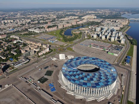 Explore an aerial view of Nizhny Novgorod's iconic football stadium, surrounded by urban landscape.