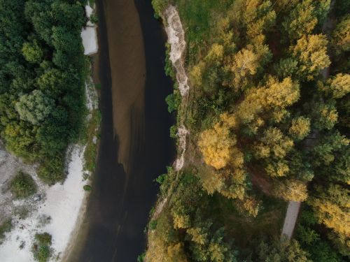 Free Serene aerial shot of a river winding through lush forest in Nizhny Novgorod Oblast, Russia. Stock Photo