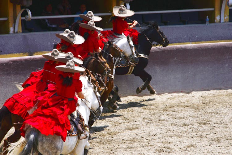 Mexican Rodeo With Men Riding Horses