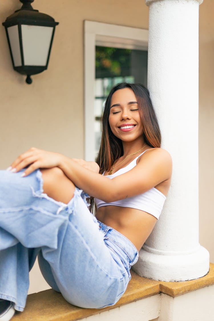 Beautiful Woman Wearing Top And Jeans 