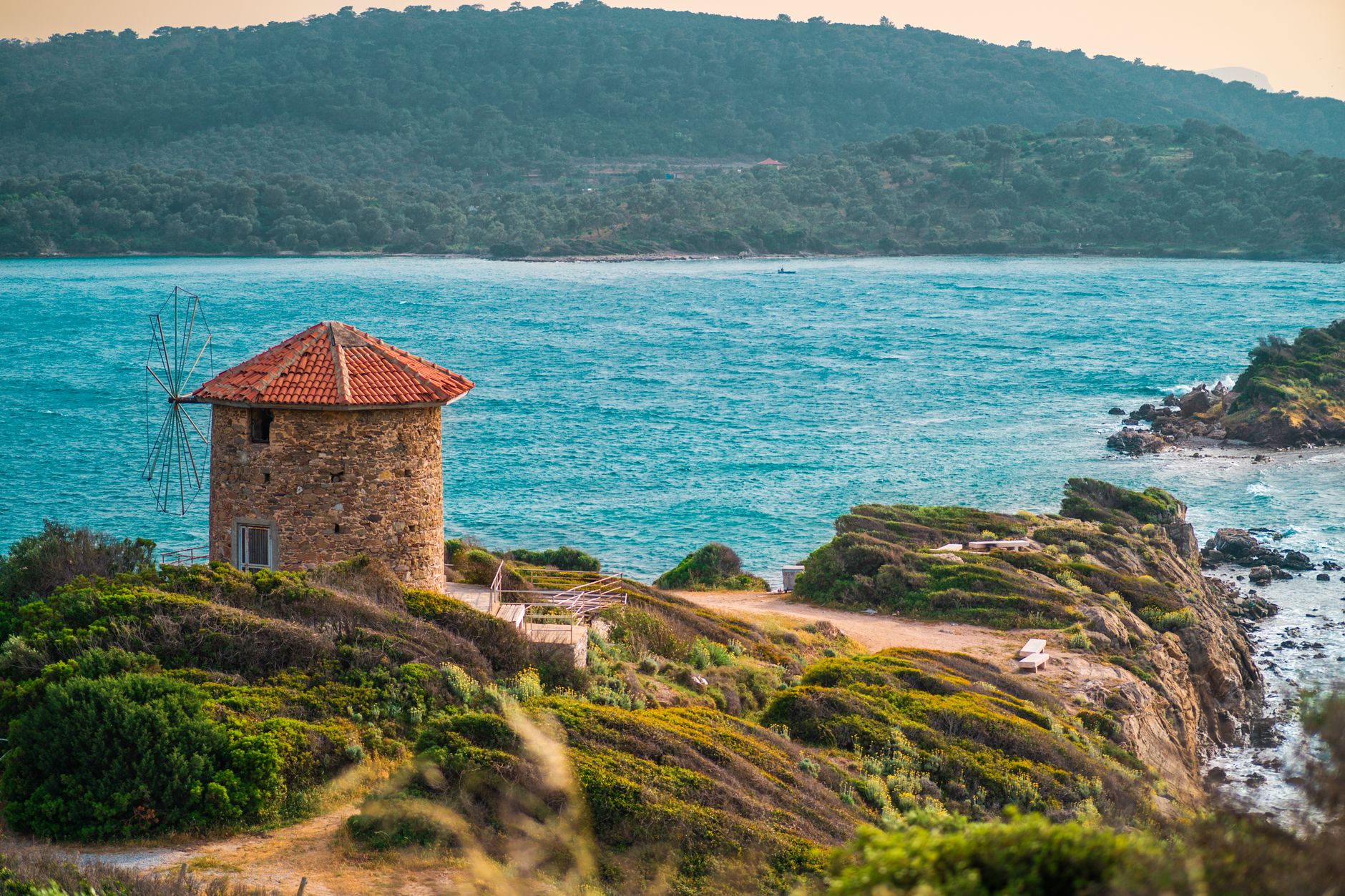 Beautiful windmill on a cliff in Bodrum, Turkey with stunning seaside views.