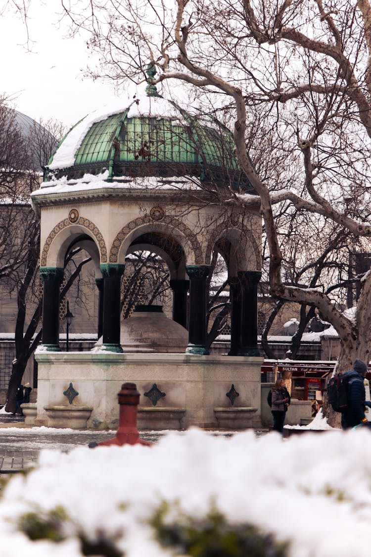 Stone Pagoda In Park In Snow