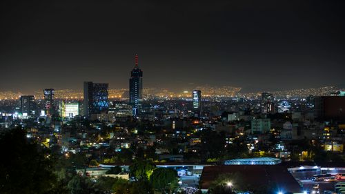 Free Stunning night view of Mexico City skyline with illuminated buildings and vibrant city lights. Stock Photo