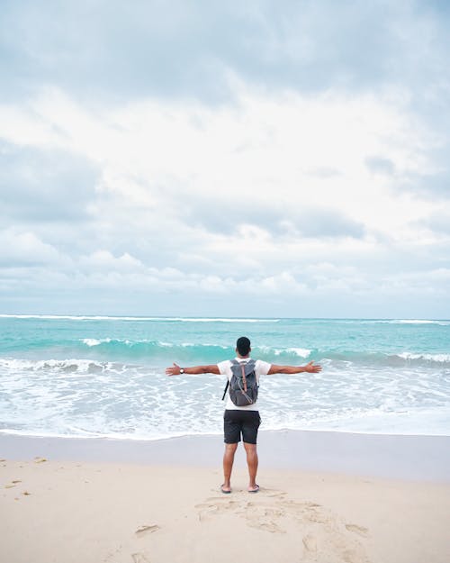 A Man Standing at the Beach 