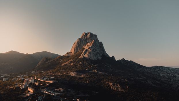 An Aerial Photography of a Rocky Mountain Under the Gray Sky