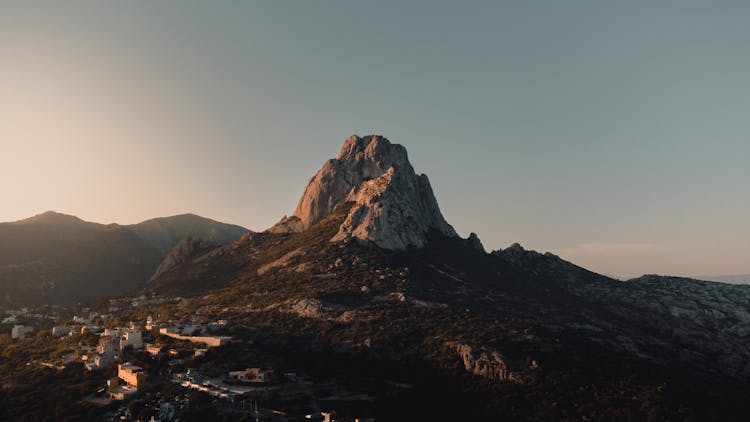 An Aerial Photography Of A Rocky Mountain Under The Gray Sky