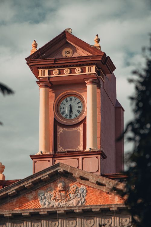 Free Close-up of the historic clock tower in Tequisquiapan, featuring architectural detail. Stock Photo