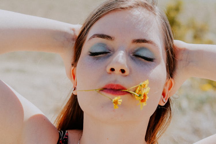 Woman With Flower In Mouth