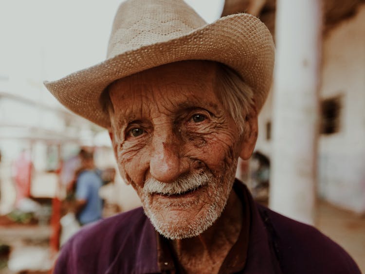 Smiling Elderly Man In Straw Hat