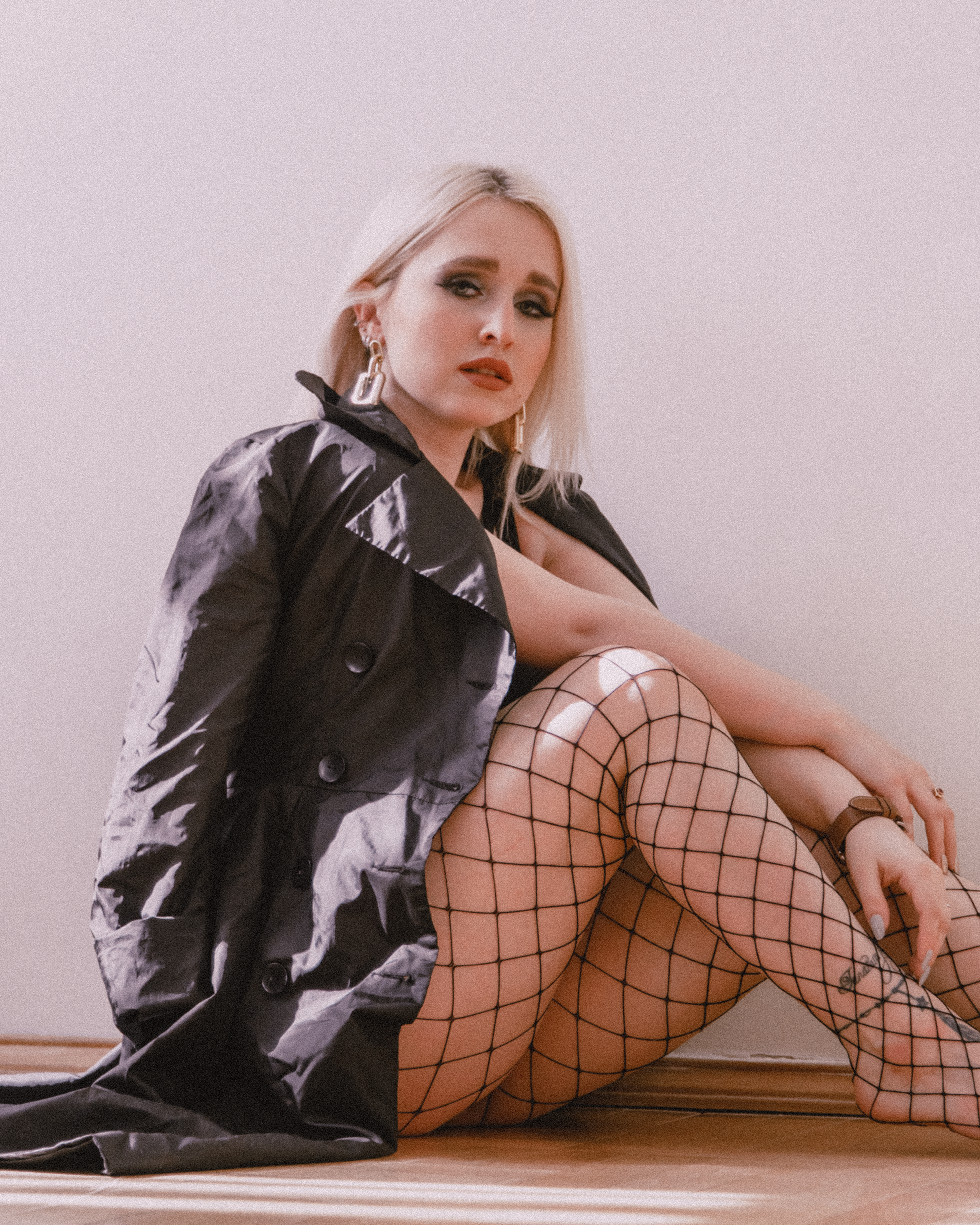 Modern photoshoot of a woman in Saint Petersburg, showcasing fashion and style.