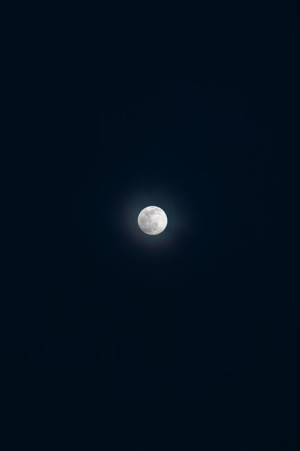 Stunning full moon prominently displayed in a clear night sky over İzmir, Turkey.