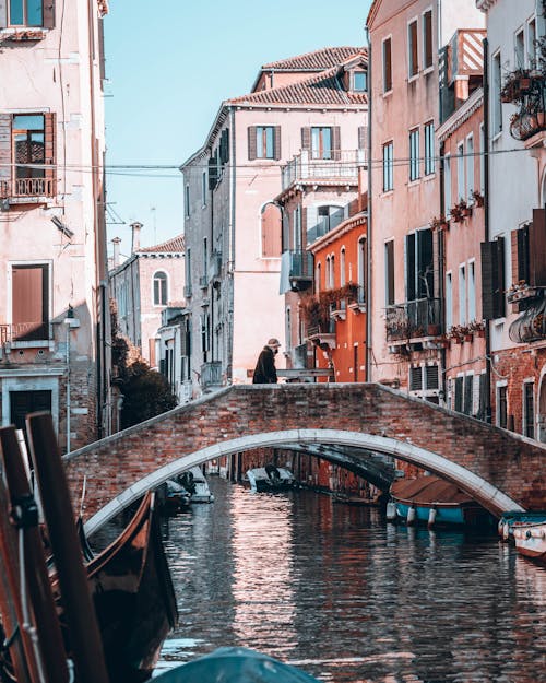 View of an Arch Bridge over the Canal and Residential Buildings in Venice, Italy