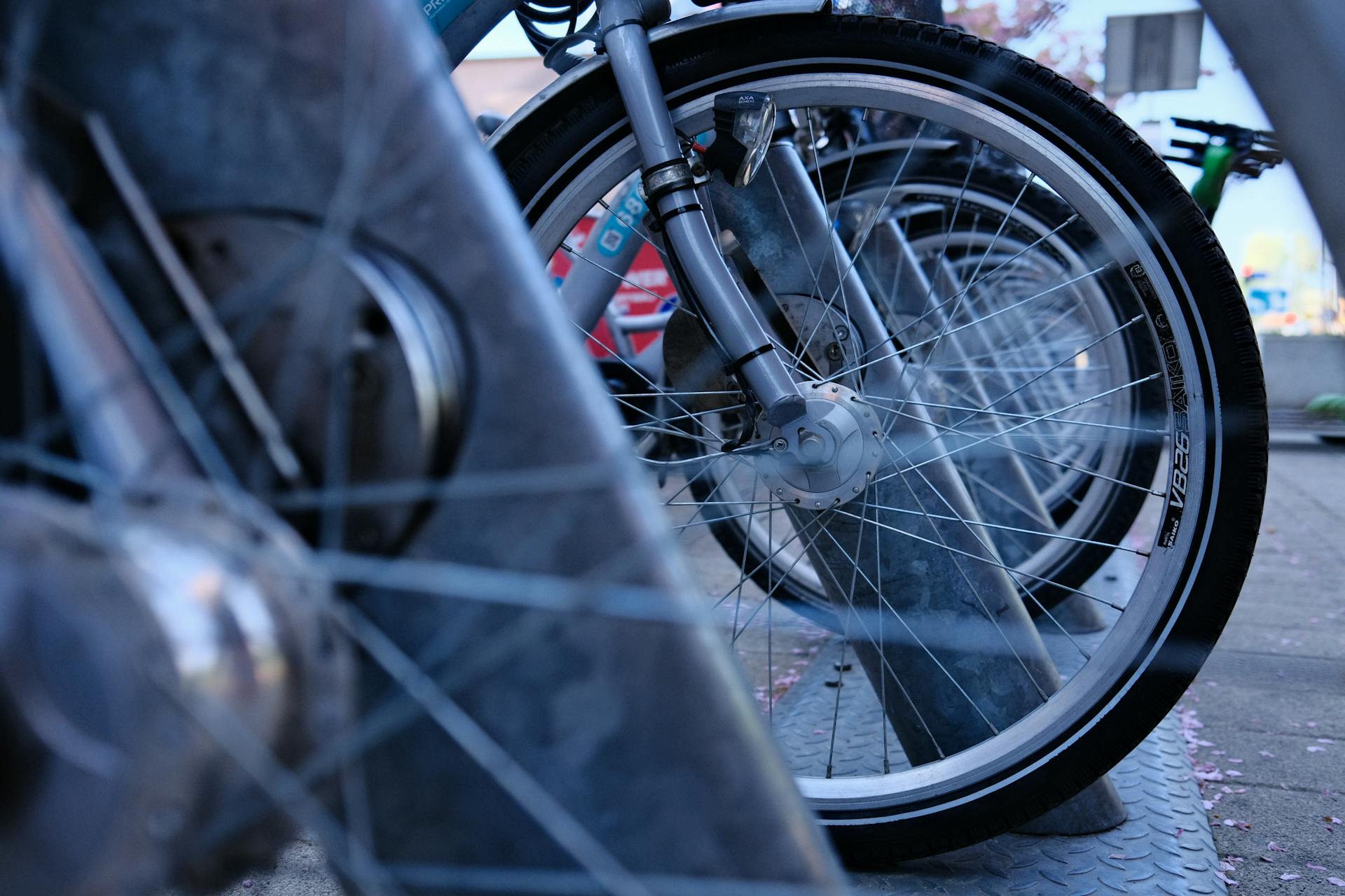 Wheals of Bicycles Parked on Street
