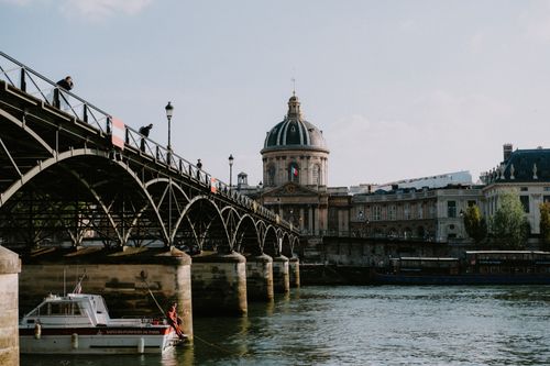 Free View of Pont des Arts and Institut de France over the Seine River in Paris. Stock Photo