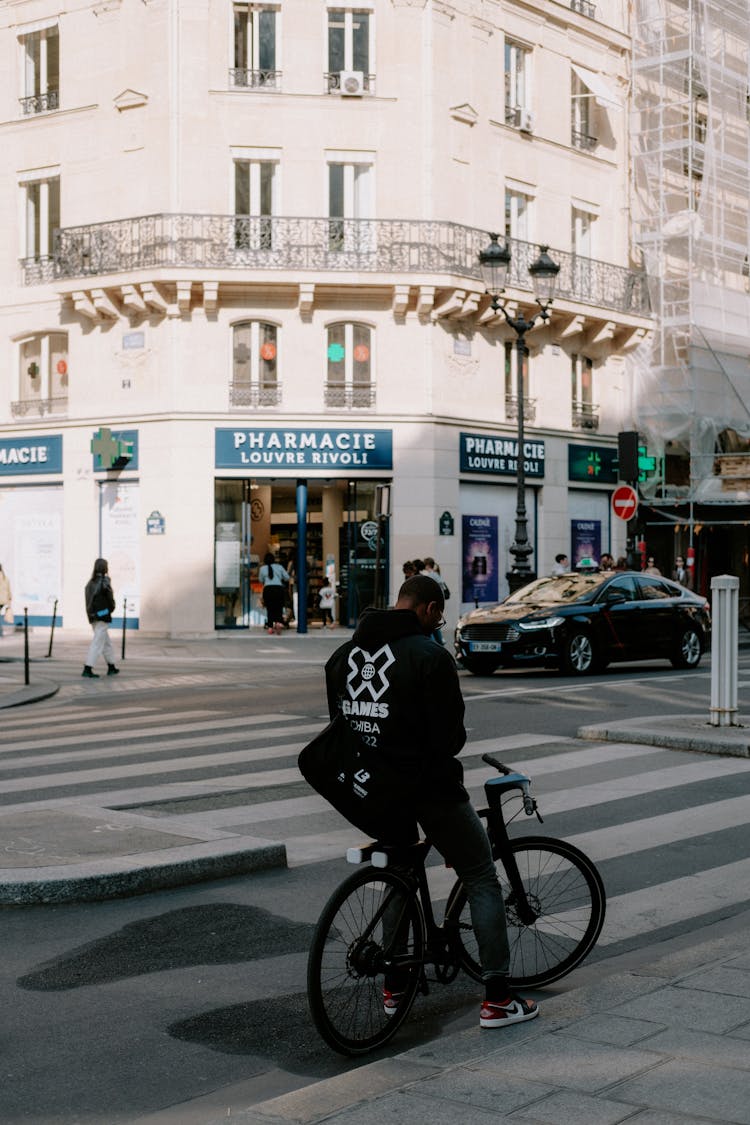 Man On Bicycle In City