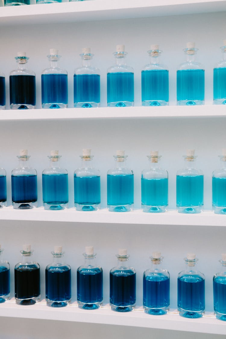 Shelves With Blue Liquid In Glasses