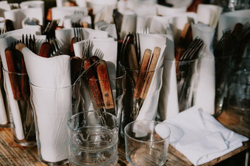 Brown and Silver Utensils in Clear Drinking Glasses