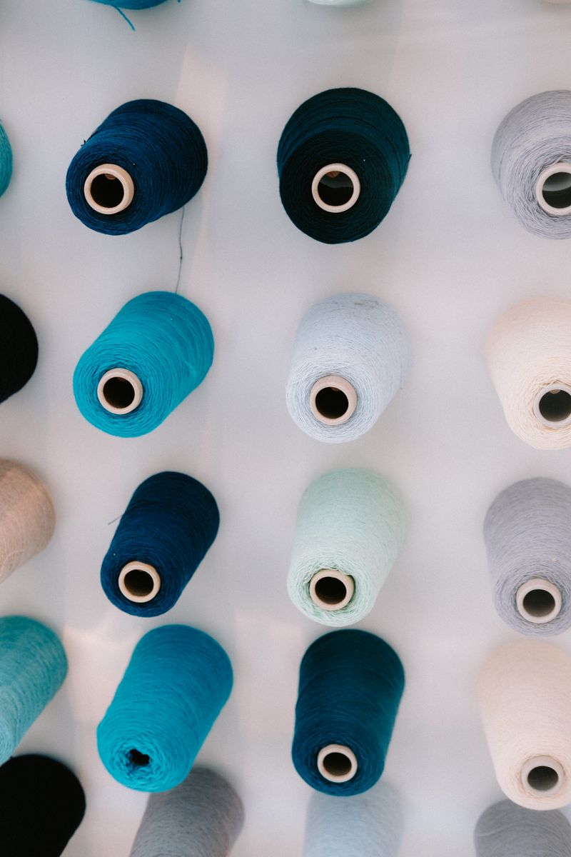 Neatly organised spools of blended yarn