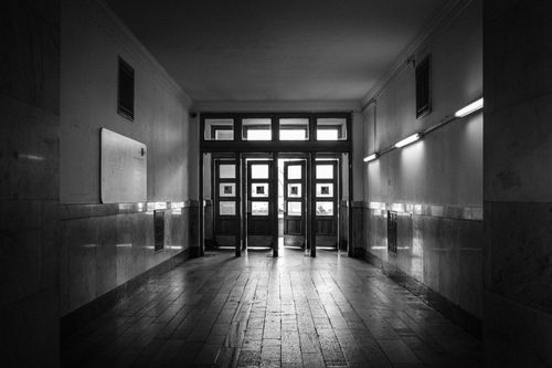 Free A moody black and white corridor with marble walls and doorways in Moscow, Russia. Stock Photo