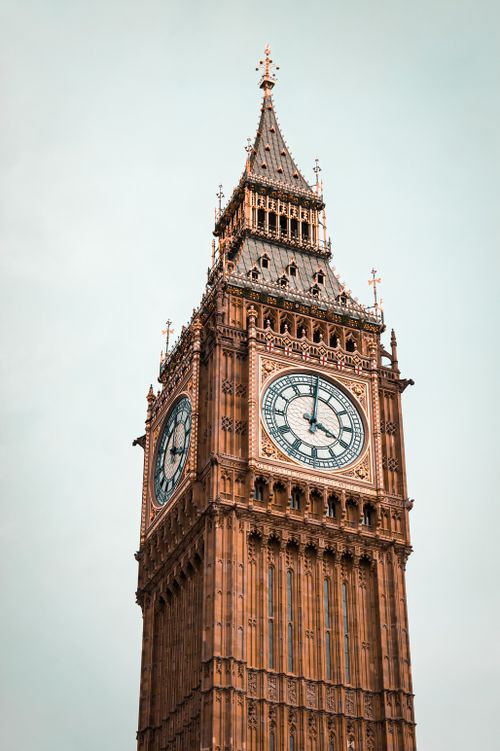 Free Stunning low angle view of the famous Elizabeth Tower in London, highlighting its historic Gothic architecture. Stock Photo