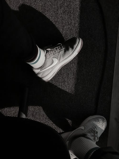 Man in Black White Nike Shoes during Nighttime · Free Stock Photo