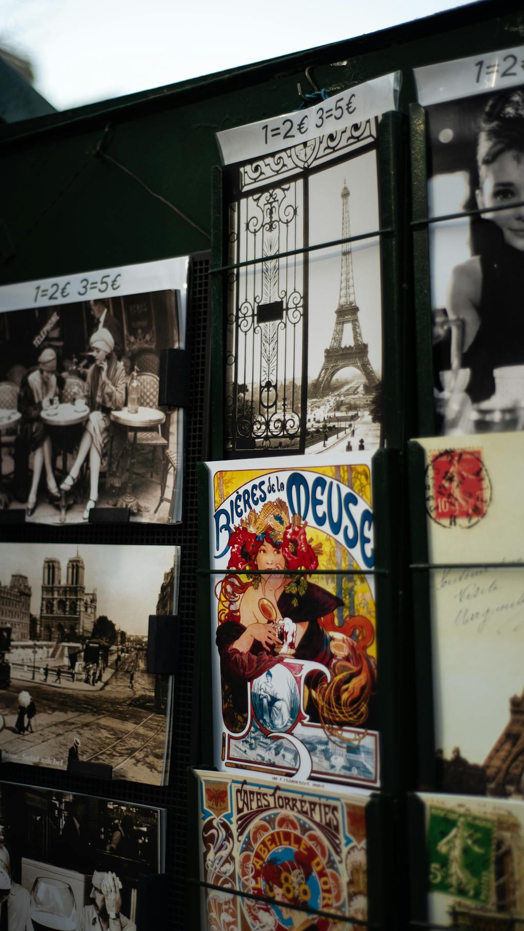 Close-up of vintage postcards with Paris scenes