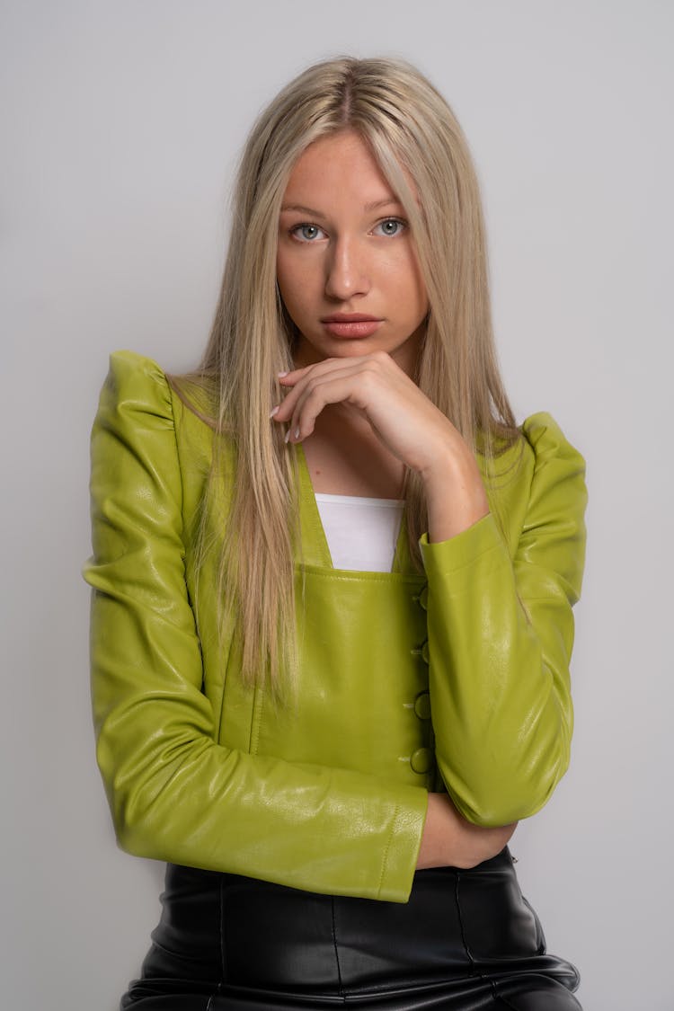 A Woman In Green Puff Long Sleeves Posing At The Camera