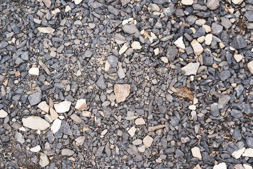 Free Close-up view of a textured gravel surface, showcasing various rock sizes and colors. Stock Photo