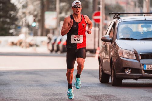 Free Athlete participating in a city marathon, showcasing endurance and focus. Stock Photo