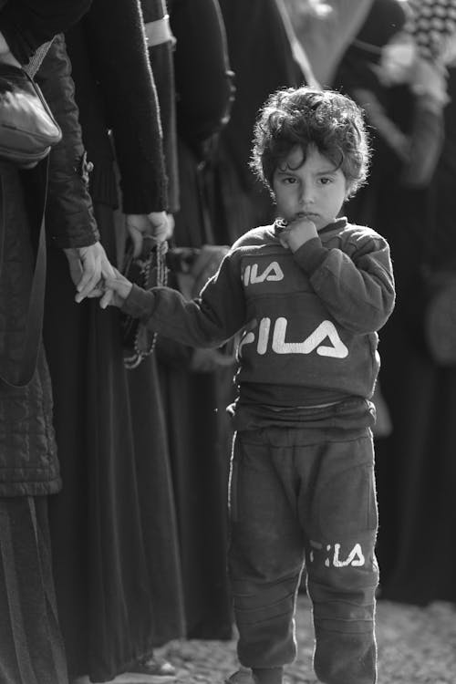 Grayscale Photo of a Kid Wearing Sweatshirt