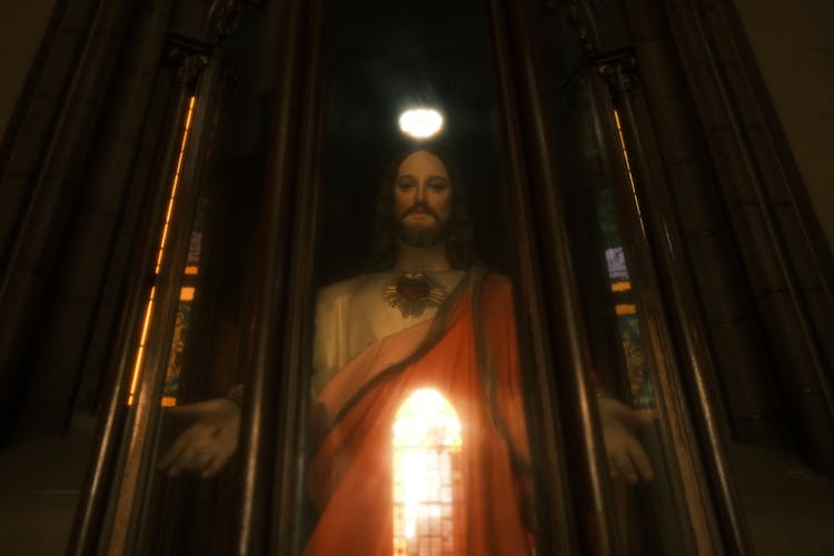 Statue Of Jesus Christ In A Glass Cabinet