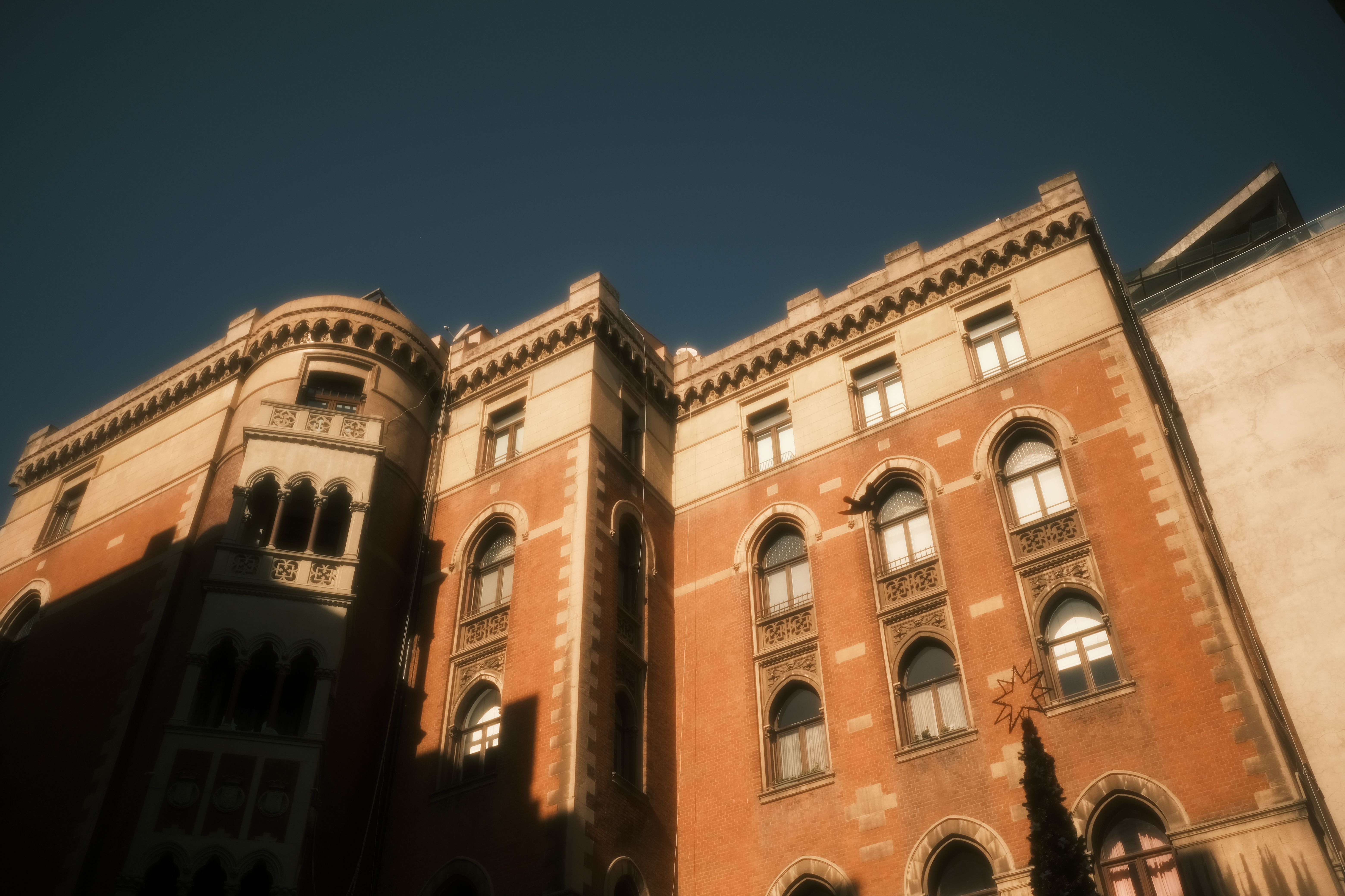 Historic Traditional Building Facade on Blue Sky · Free Stock Photo