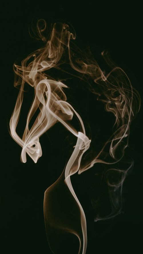Free A captivating abstract smoke formation against a black background, creating an artistic and mysterious atmosphere. Stock Photo