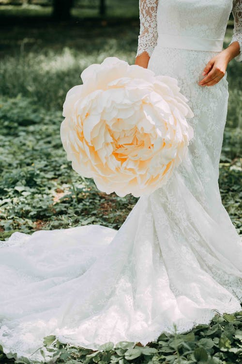 Woman Holding White Petaled Flower