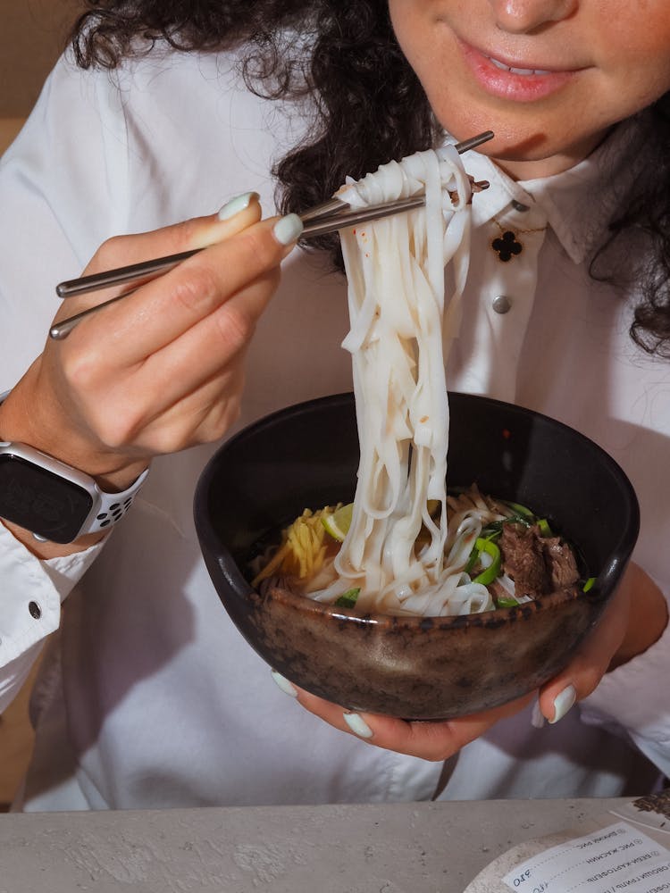 Woman Eating Noodles 