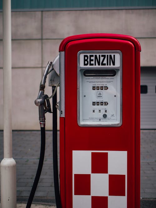 Red Vintage Gasoline Pump with Nozzle