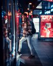 Man Entering Public Transportation at Night