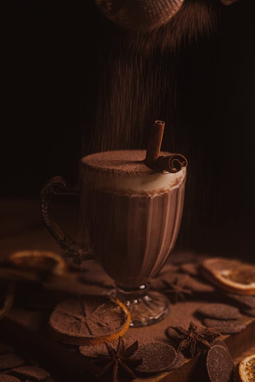 Free Adding Cocoa to Chocolate Drink Stock Photo