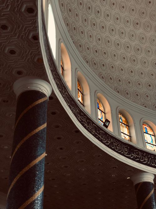 Free Explore the ornate patterns and stained glass windows in this stunning Amman mosque interior. Stock Photo
