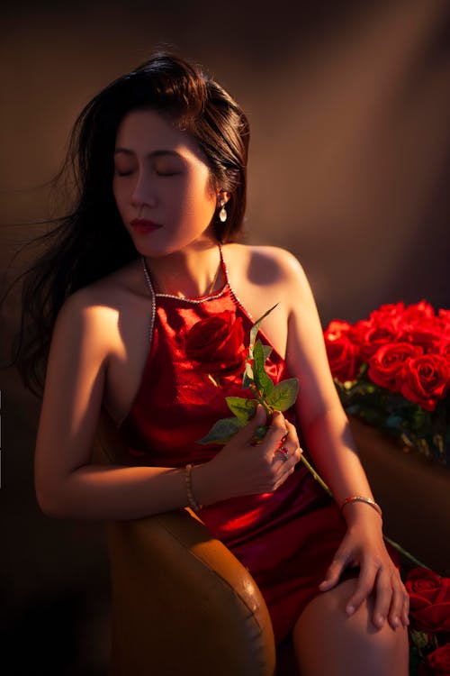 Free Woman in Red Dress with Red Rose Stock Photo