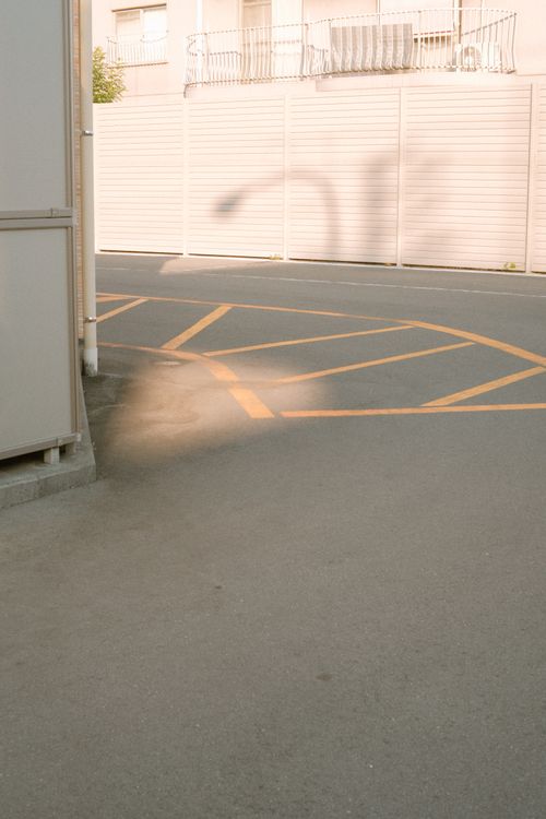 Free Serene urban street with filtered morning light casting soft shadows. Stock Photo